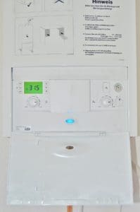 white water heater mounted to a wall